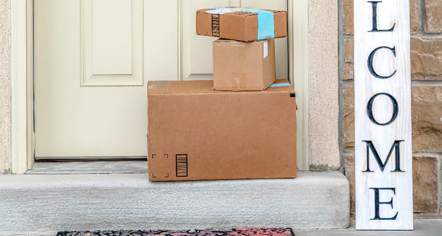 Boxes by the door of a residence with a welcome sign in Amarillo